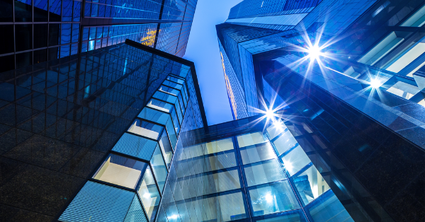 Tall glass office buildings with star shaped reflections